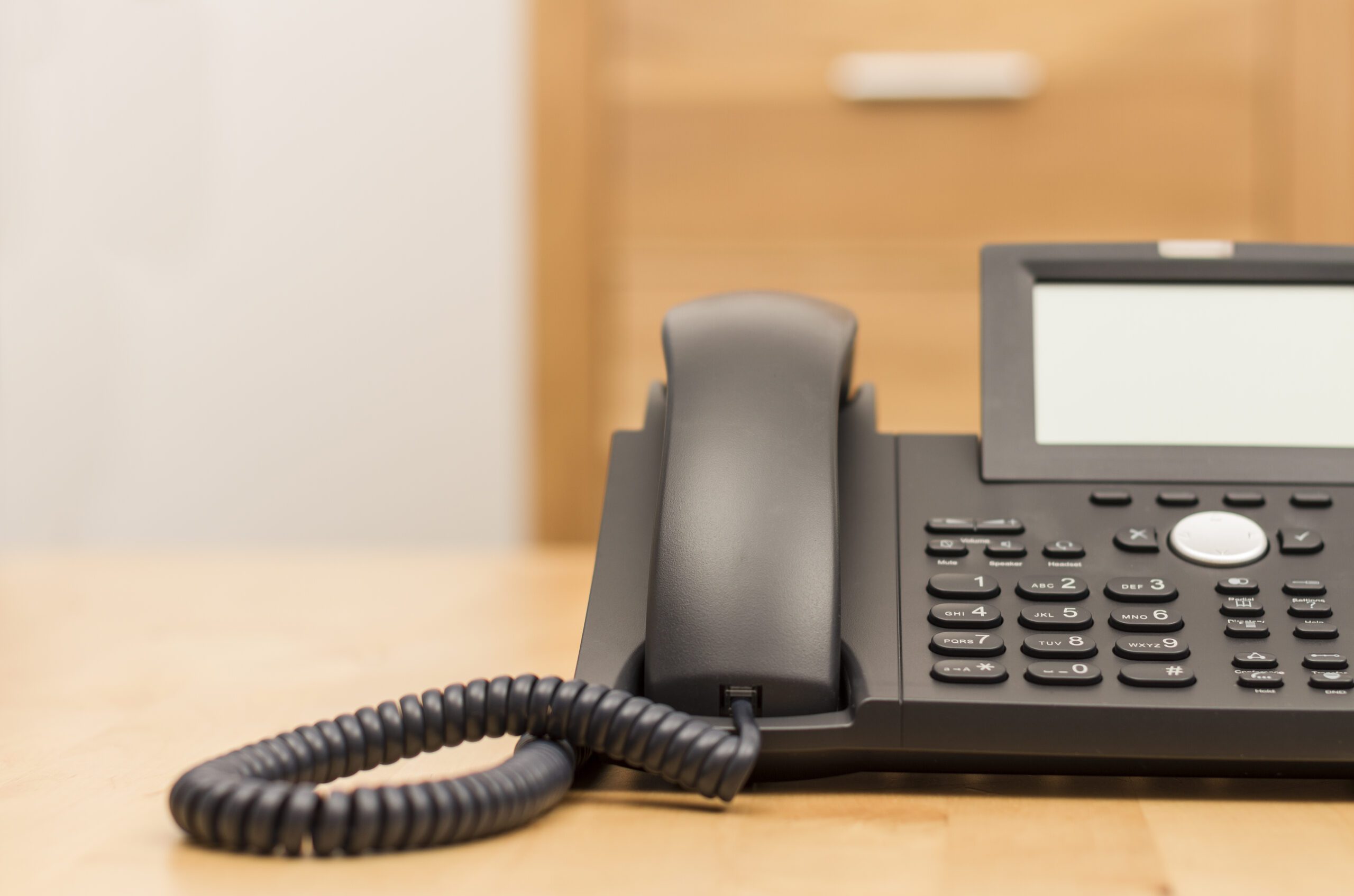 Modern Black Phone on Wooden Desk